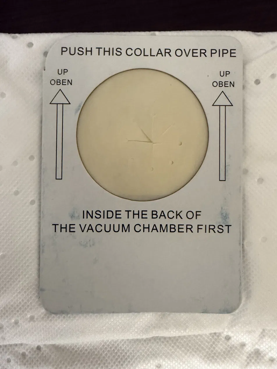 Genuine InterVac Y11 dust bag back collar showing InterVac's original printed artwork: PUSH THIS COLLAR OVER PIPE, UP / OBEN arrows, and INSIDE THE BACK OF THE VACUUM CHAMBER FIRST.
